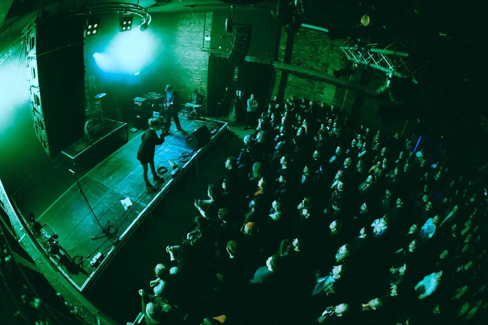 Aidan Mansell playing guitar live